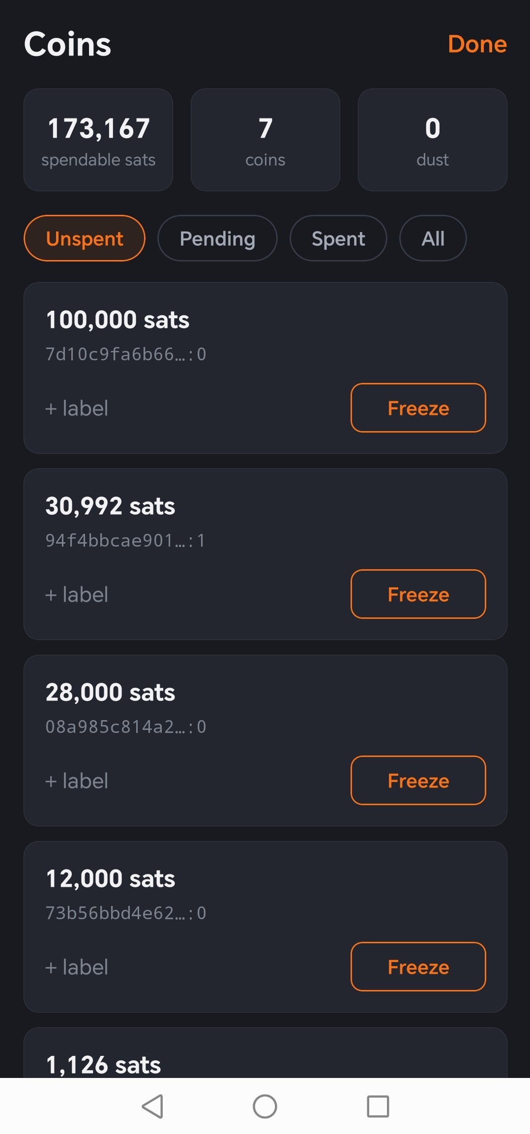 The Coins screen listing unspent coins with amounts, a label action and a freeze button on each